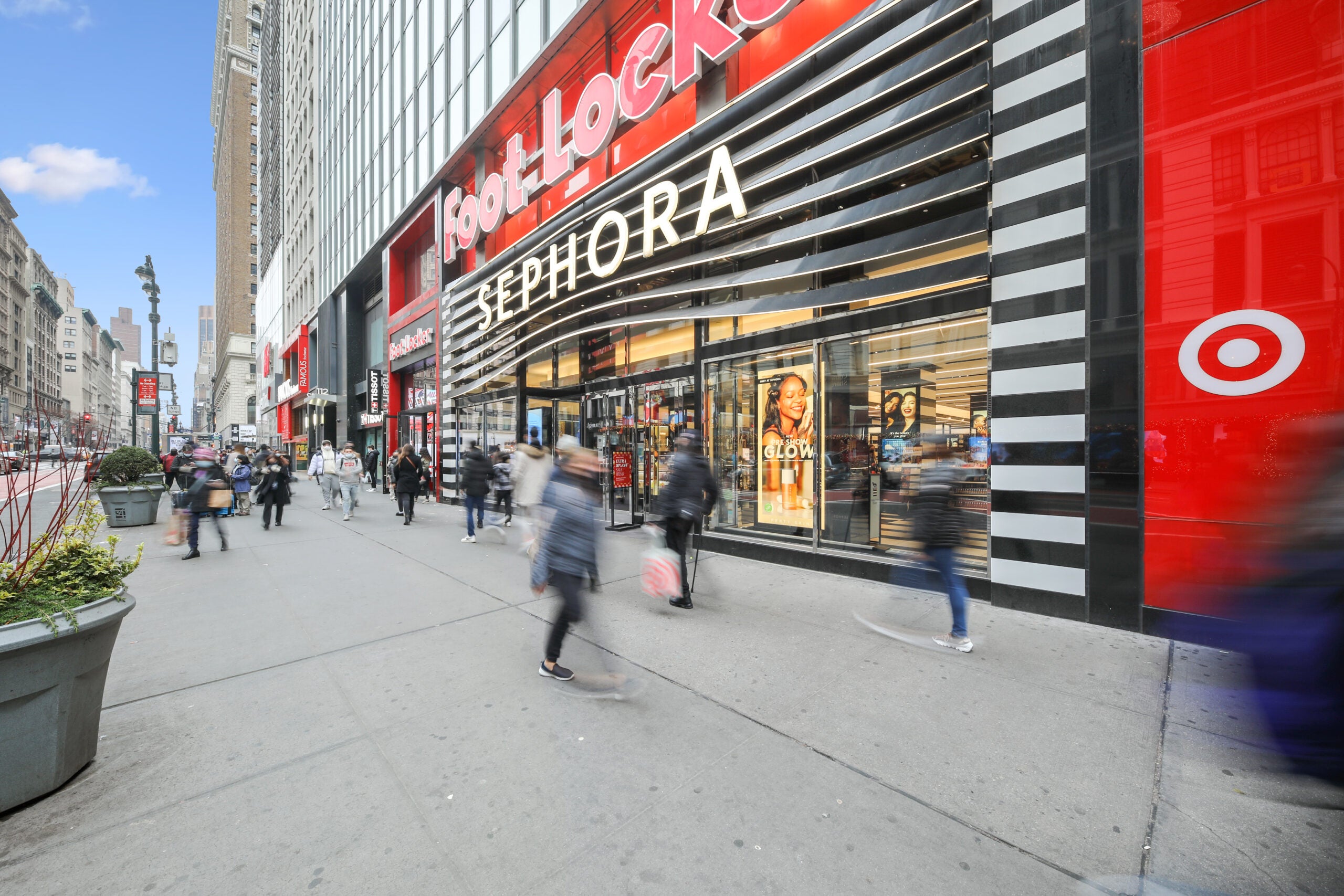 People walking on the street in front of 112 West 34th Street