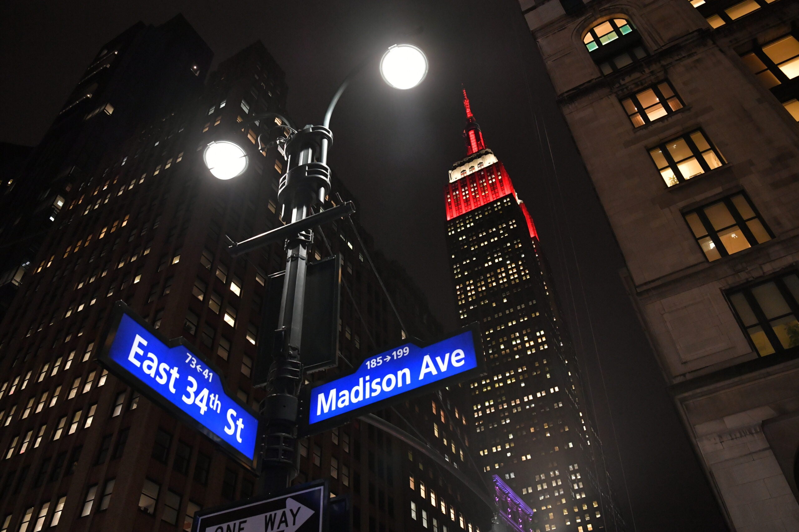 Empire State Building’s world-famous tower lights shines in red and white to honor those affected by the earthquake